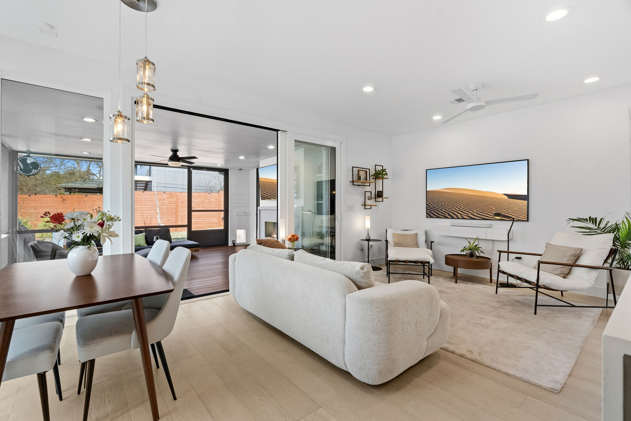 2508 Paramount Avenue, Unit B Austin, TX 78704 - Photo 12 of 40 The sleek & modern kitchen flows seamlessly into the living and dining areas, while accordion sliders extend the space into a recently completed sunroom with fireplace and fan.