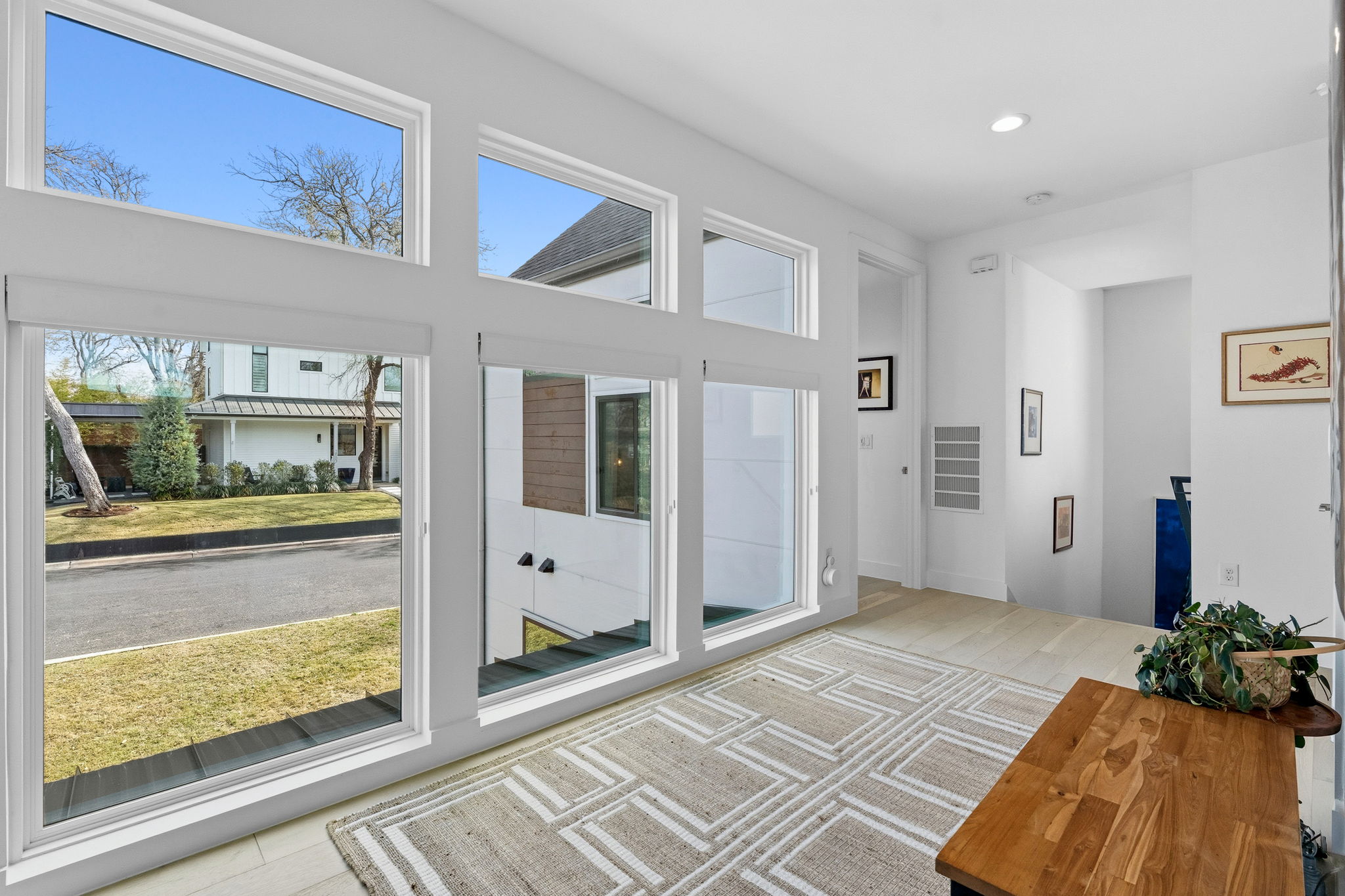 2508 Paramount Avenue, Unit B Austin, TX 78704 - Photo 22 of 40 Upstairs on the second floor the spacious open hallway features a wall of stacked windows that bathe the entire floor in natural light.