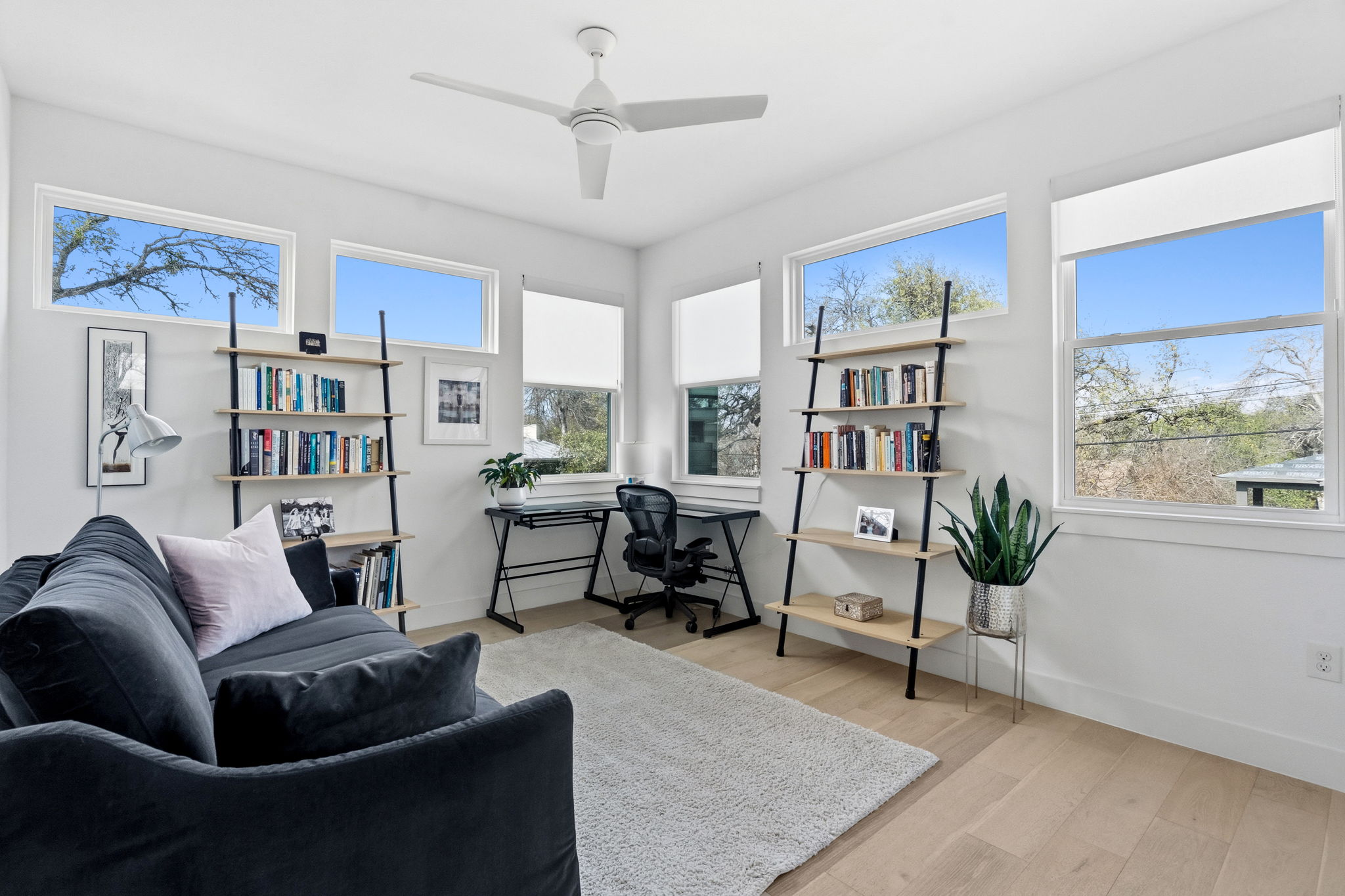 2508 Paramount Avenue, Unit B Austin, TX 78704 - Photo 25 of 40 The second floor offers this sun-lit secondary bedroom wrapped in windows with closet storage and its own ensuite bath.