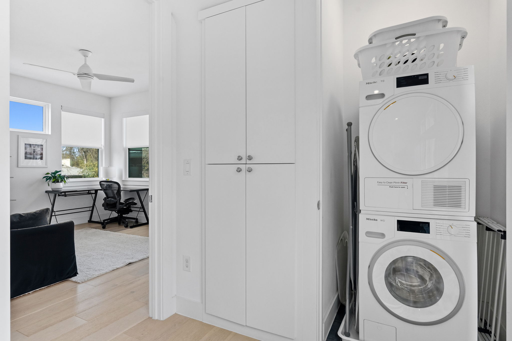 2508 Paramount Avenue, Unit B Austin, TX 78704 - Photo 31 of 40 The in home laundry closet is conveniently situated on the second floor alongside built-in storage cabinetry.