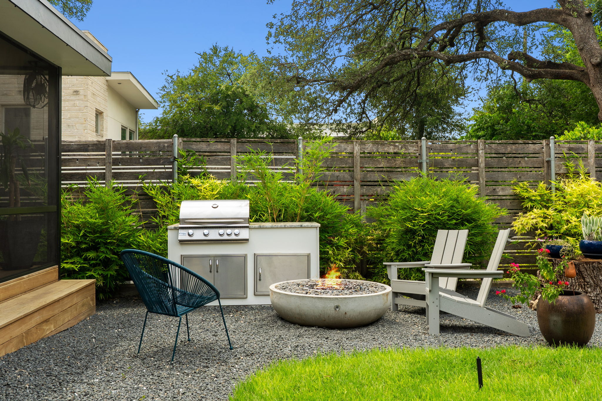 2508 Paramount Avenue, Unit B Austin, TX 78704 - Photo 34 of 40 Elevate your cookouts with a cozy fire pit area, all enclosed in tall privacy fencing and hedges.