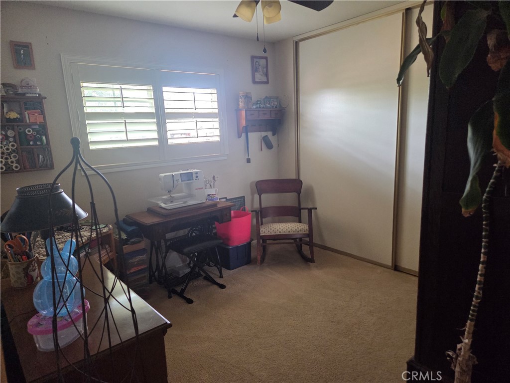 13955 Iroquois Road Apple Valley, CA 92307 - Photo 15 of 19 a room with furniture and a window