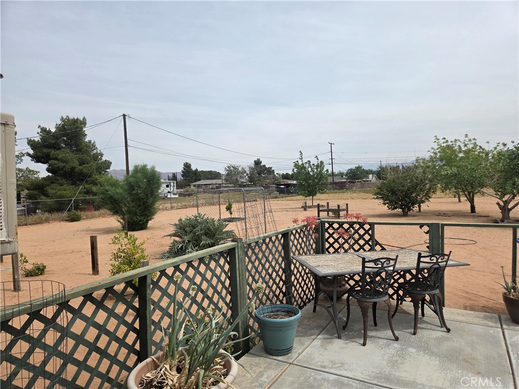 13955 Iroquois Road Apple Valley, CA 92307 - Photo 18 of 19 a view of a chairs and table on the terrace