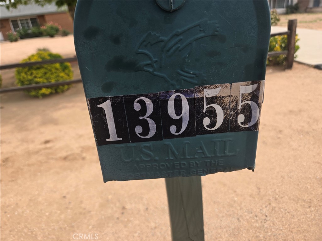 13955 Iroquois Road Apple Valley, CA 92307 - Photo 2 of 19 a view of outdoor space with sign board