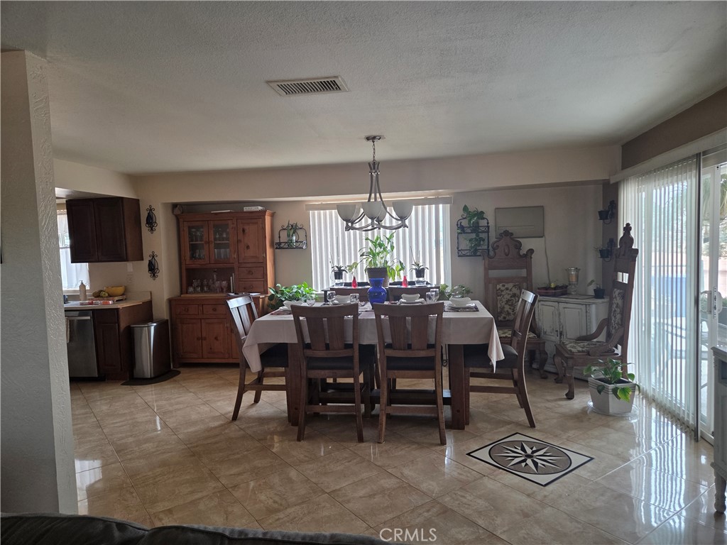 13955 Iroquois Road Apple Valley, CA 92307 - Photo 5 of 19 a view of a dining room with furniture