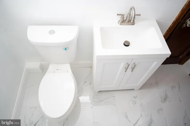 a utility room with a sink a washer and dryer