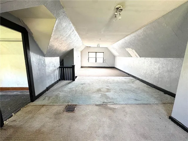 a view of a big room with windows