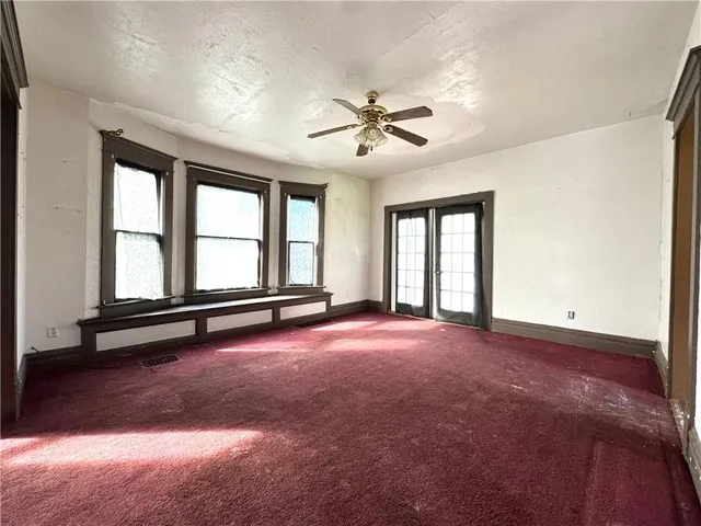a view of an empty room with a window