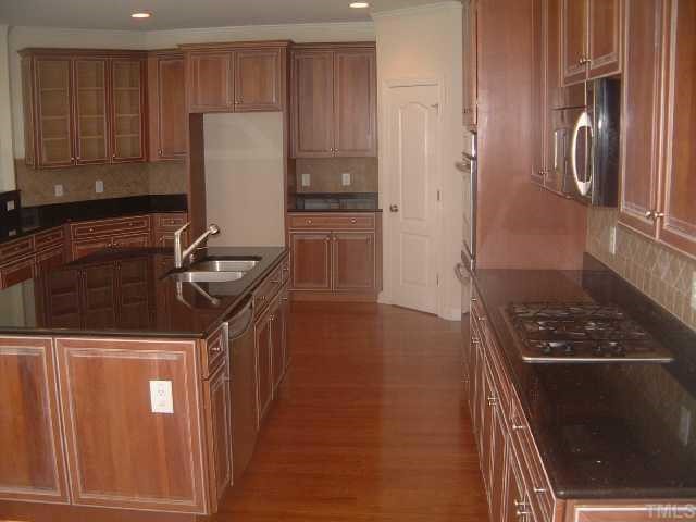 2916 Elmfield Street Raleigh, NC 27614 - Photo 3 of 10 View 2 of the kitchen which also includes beautiful hardwoods, tons of storage space and a SS gas cooktop.