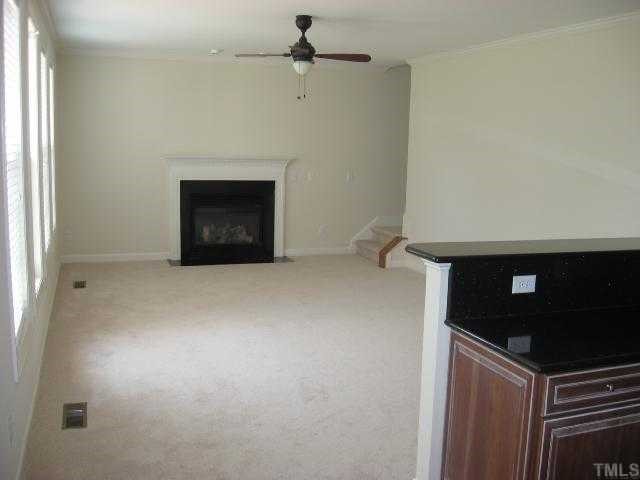 2916 Elmfield Street Raleigh, NC 27614 - Photo 4 of 10 The kitchen overlooks the family room that includes new upgraded carpet, fresh paint and warm neutral colors.