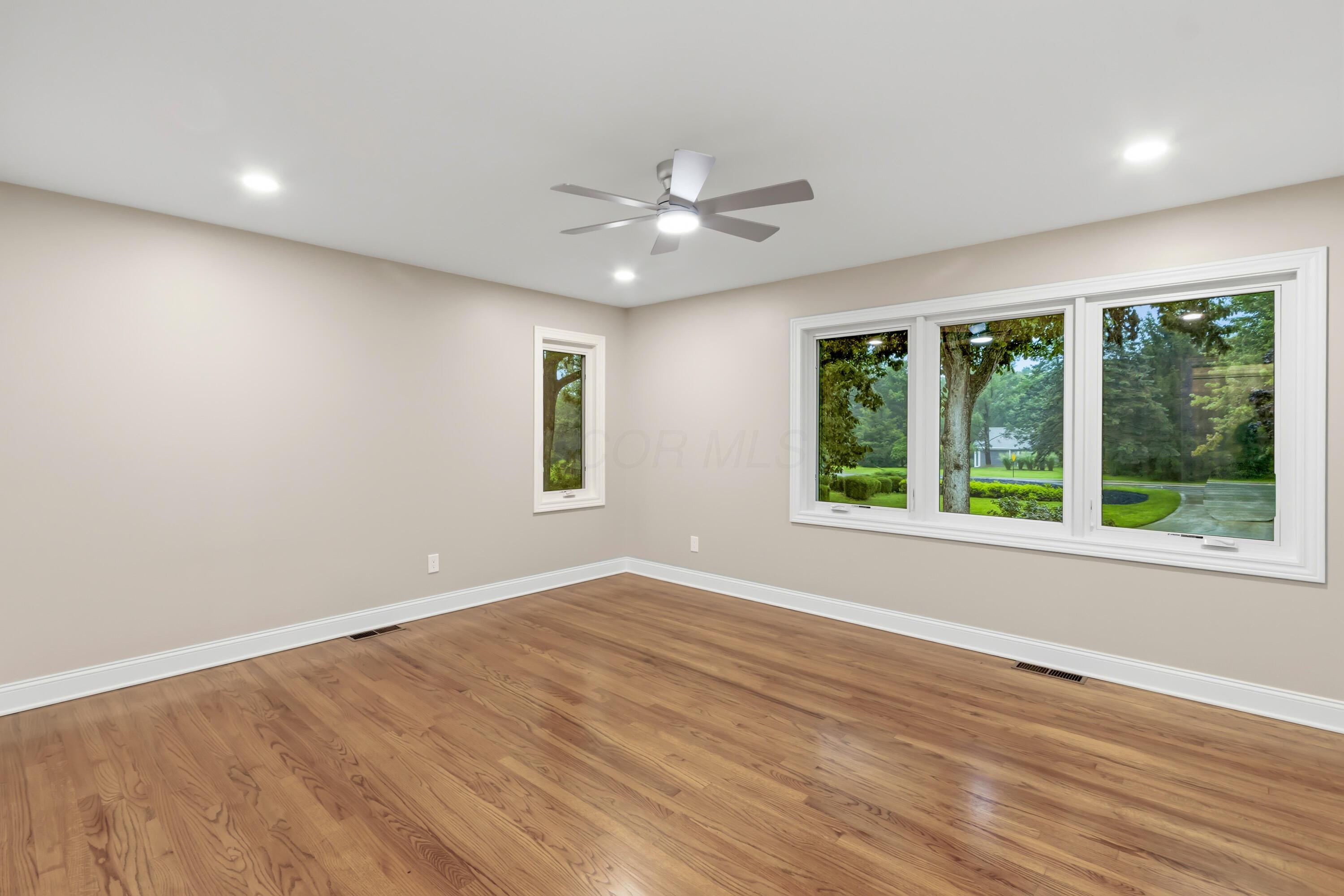 1560 Carriage Road Powell, OH 43065 - Photo 43 of 73 Hardwood flooring, recessed lighting, ceiling fan, and multiple large windows