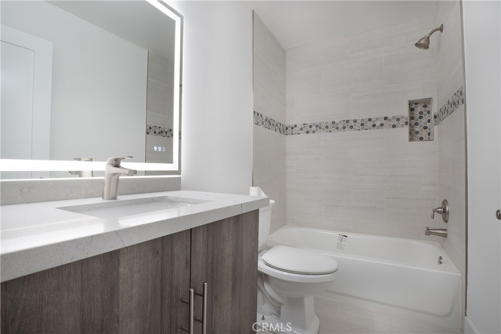 13 Brookmont, Unit 60 Irvine, CA 92604 - Photo 15 of 27 a bathroom with a sink a toilet and shower