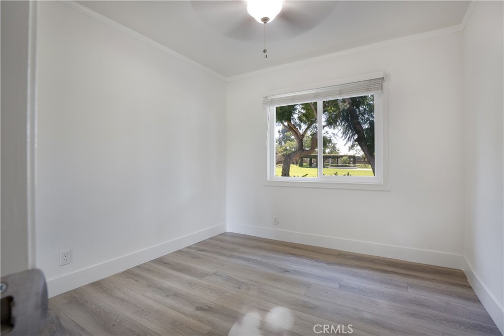 13 Brookmont, Unit 60 Irvine, CA 92604 - Photo 16 of 27 wooden floor in an empty room with a window
