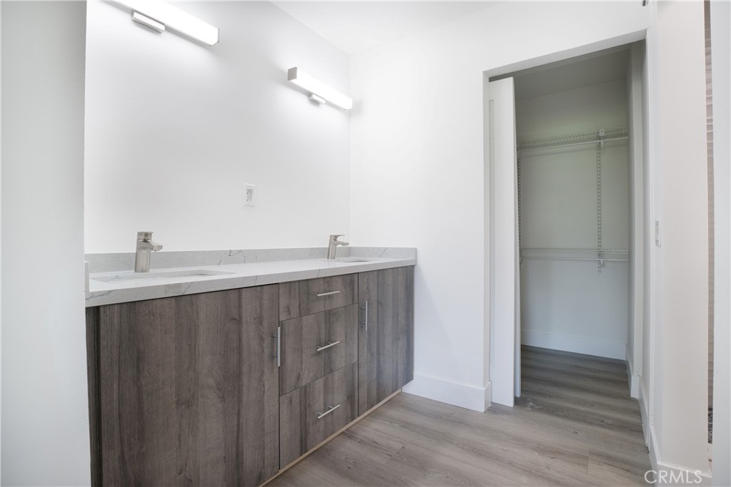 13 Brookmont, Unit 60 Irvine, CA 92604 - Photo 20 of 27 a bathroom with a sink and a mirror