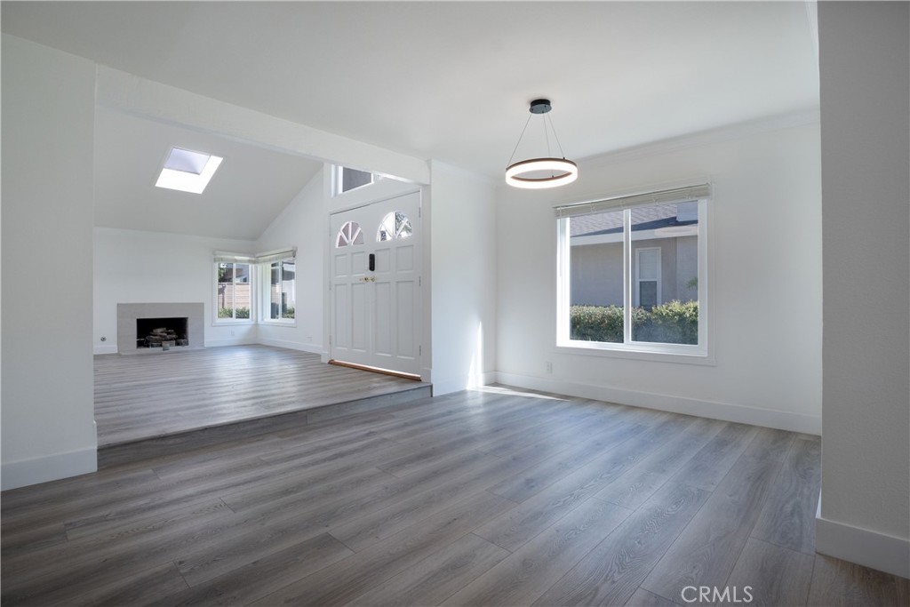 13 Brookmont, Unit 60 Irvine, CA 92604 - Photo 22 of 27 a view of empty room with wooden floor and window