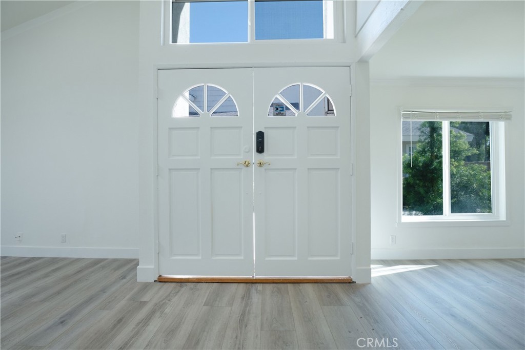 13 Brookmont, Unit 60 Irvine, CA 92604 - Photo 7 of 27 a view of entryway with wooden floor