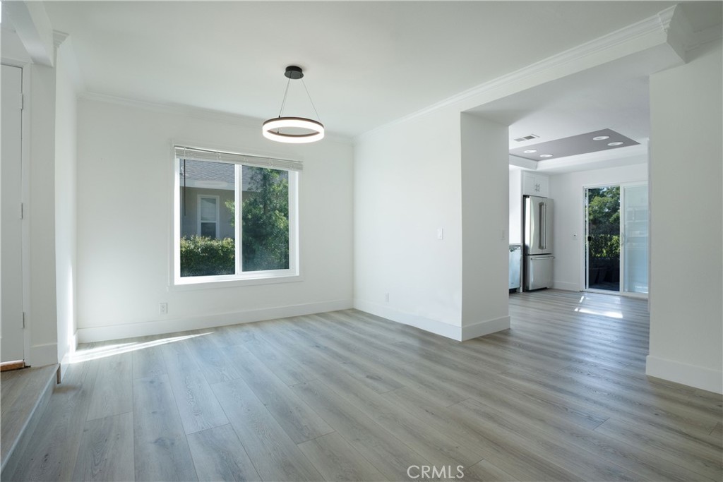 13 Brookmont, Unit 60 Irvine, CA 92604 - Photo 10 of 27 wooden floor in an empty room with a window