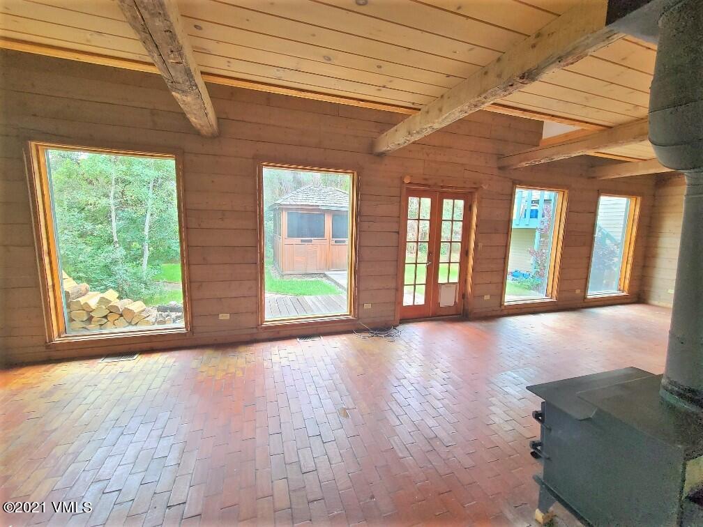 755 Bull Run Eagle, CO 81631 - Photo 18 of 19 a view of an empty room with wooden floor and a window
