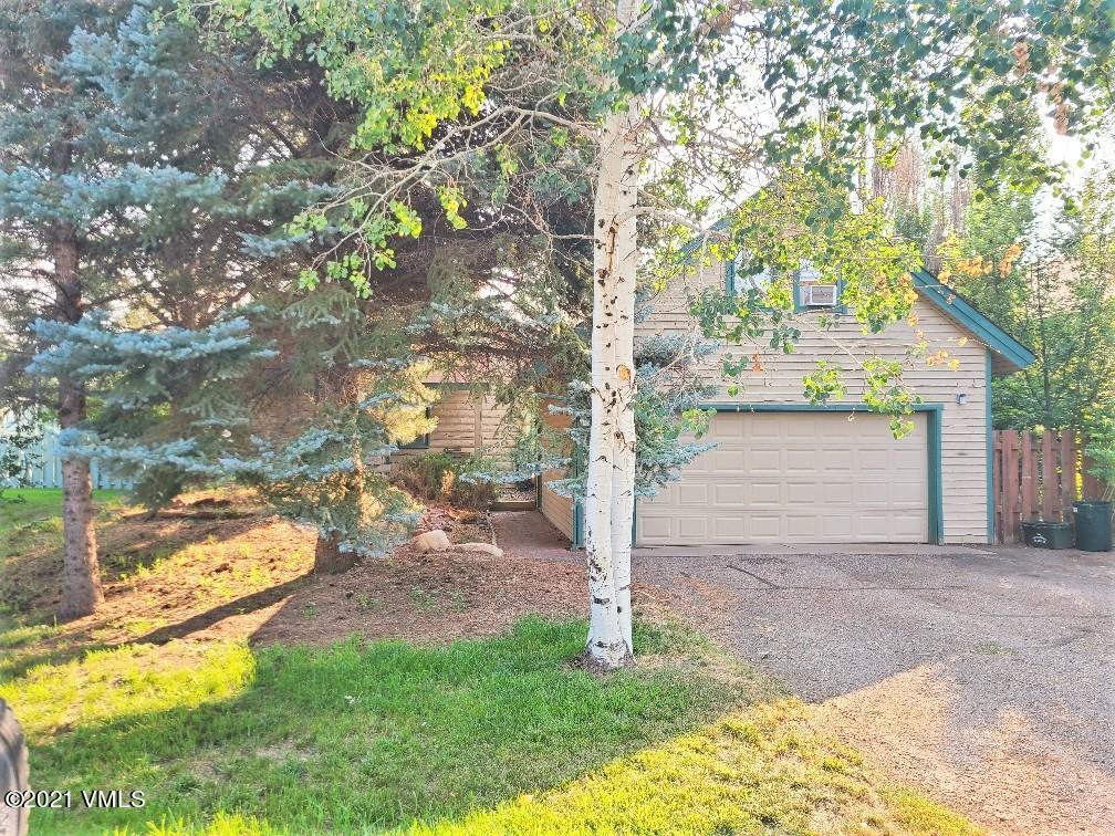 755 Bull Run Eagle, CO 81631 - Photo 2 of 19 a view of a yard with plants and large trees