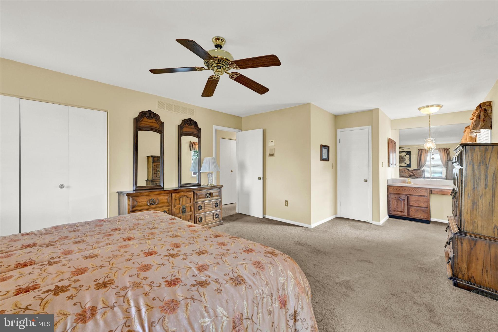 4009 Eland Road Phoenix, MD 21131 - Photo 15 of 38 a bedroom with a bed and a chandelier