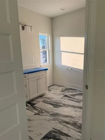 a view of a kitchen with a sink