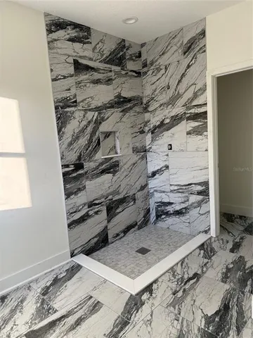 a kitchen with stainless steel appliances granite countertop a sink stove and wooden floor