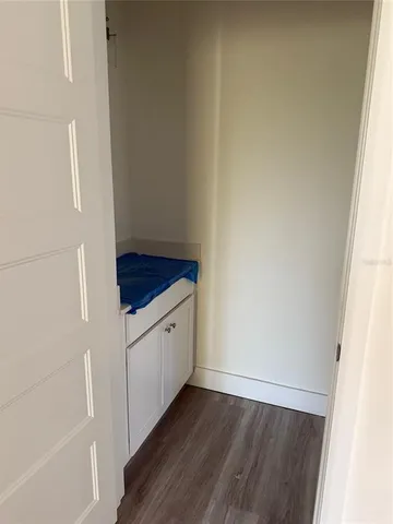 a hallway with wooden floor