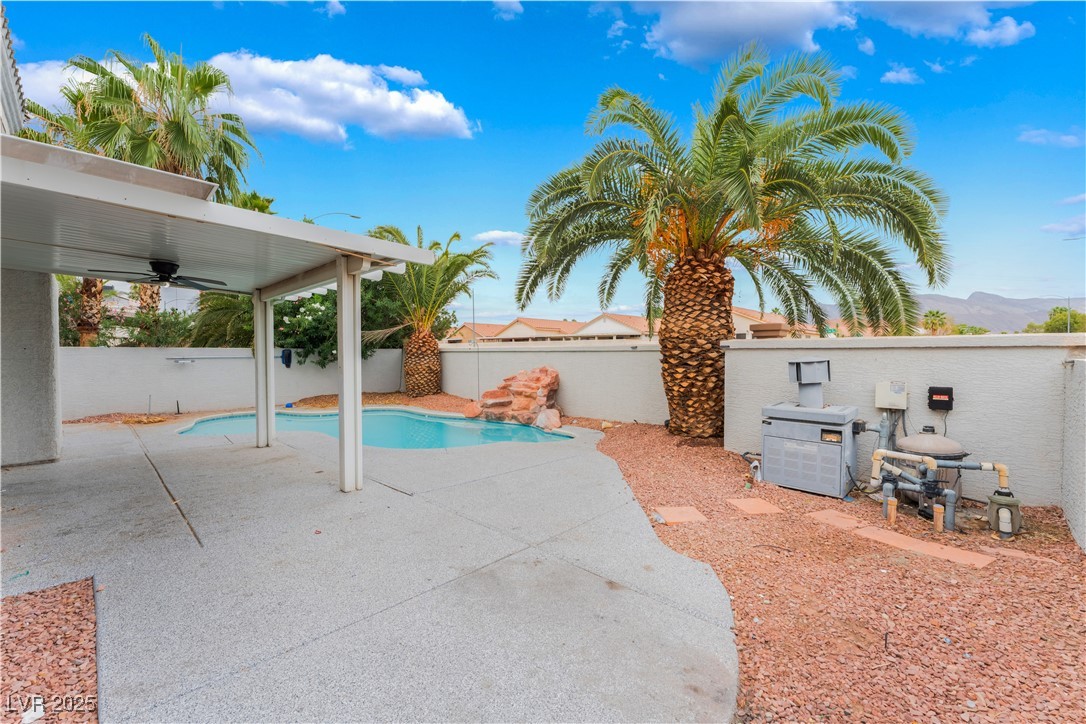 3695 Funston Way Las Vegas, NV 89129 - Photo 42 of 43 View of swimming pool featuring a fenced backyard, a ceiling fan, and a patio