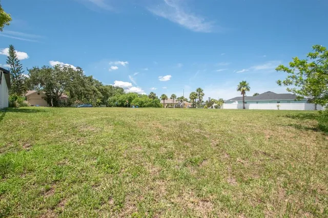a view of a lake with a bench in the background