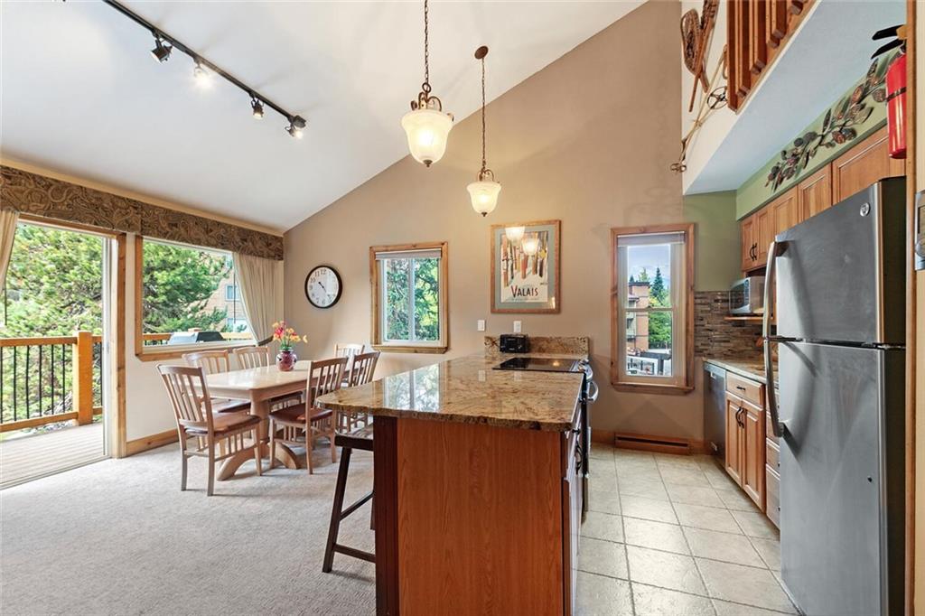 a view of a kitchen with furniture and a window