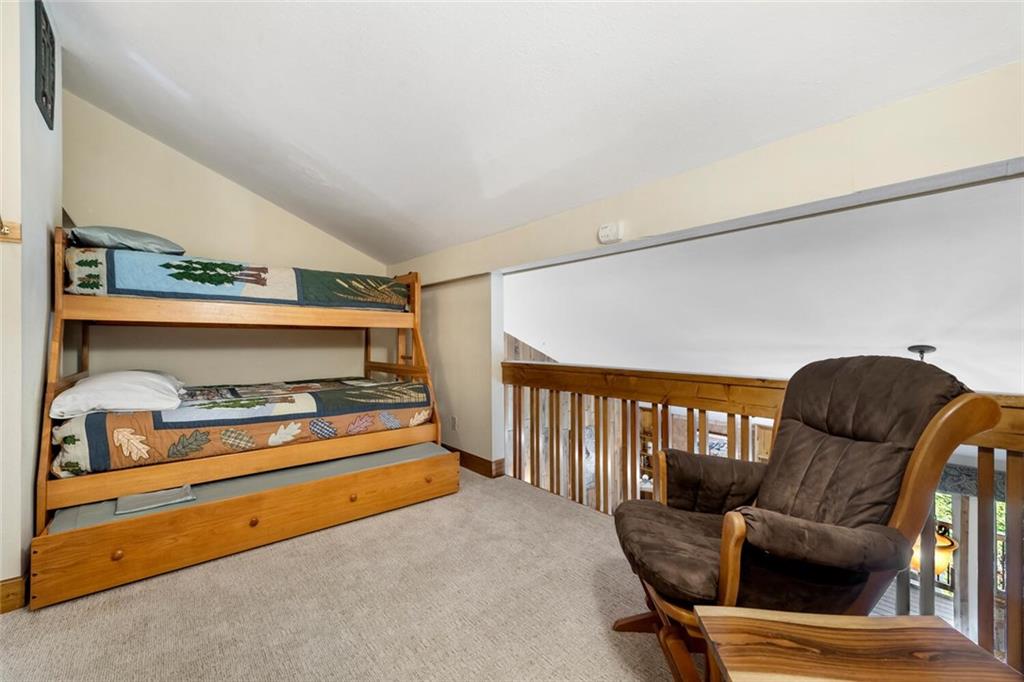 760 Columbine Road, Unit A12 Breckenridge, CO 80424 - Photo 15 of 35 a bedroom with furniture and a chair
