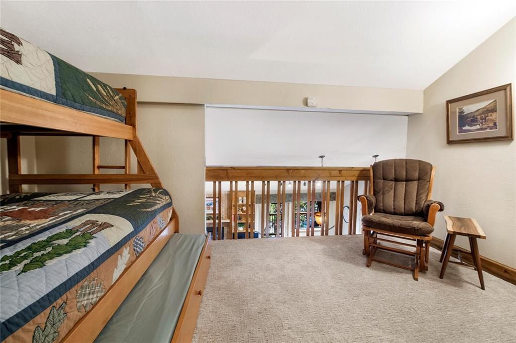 760 Columbine Road, Unit A12 Breckenridge, CO 80424 - Photo 16 of 35 a living room with furniture and a flat screen tv