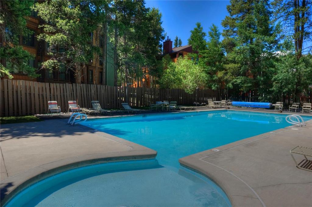 760 Columbine Road, Unit A12 Breckenridge, CO 80424 - Photo 35 of 35 a view of a park with large trees and wooden fence