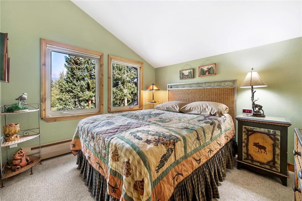 760 Columbine Road, Unit A12 Breckenridge, CO 80424 - Photo 5 of 35 a bedroom with a bed and a window