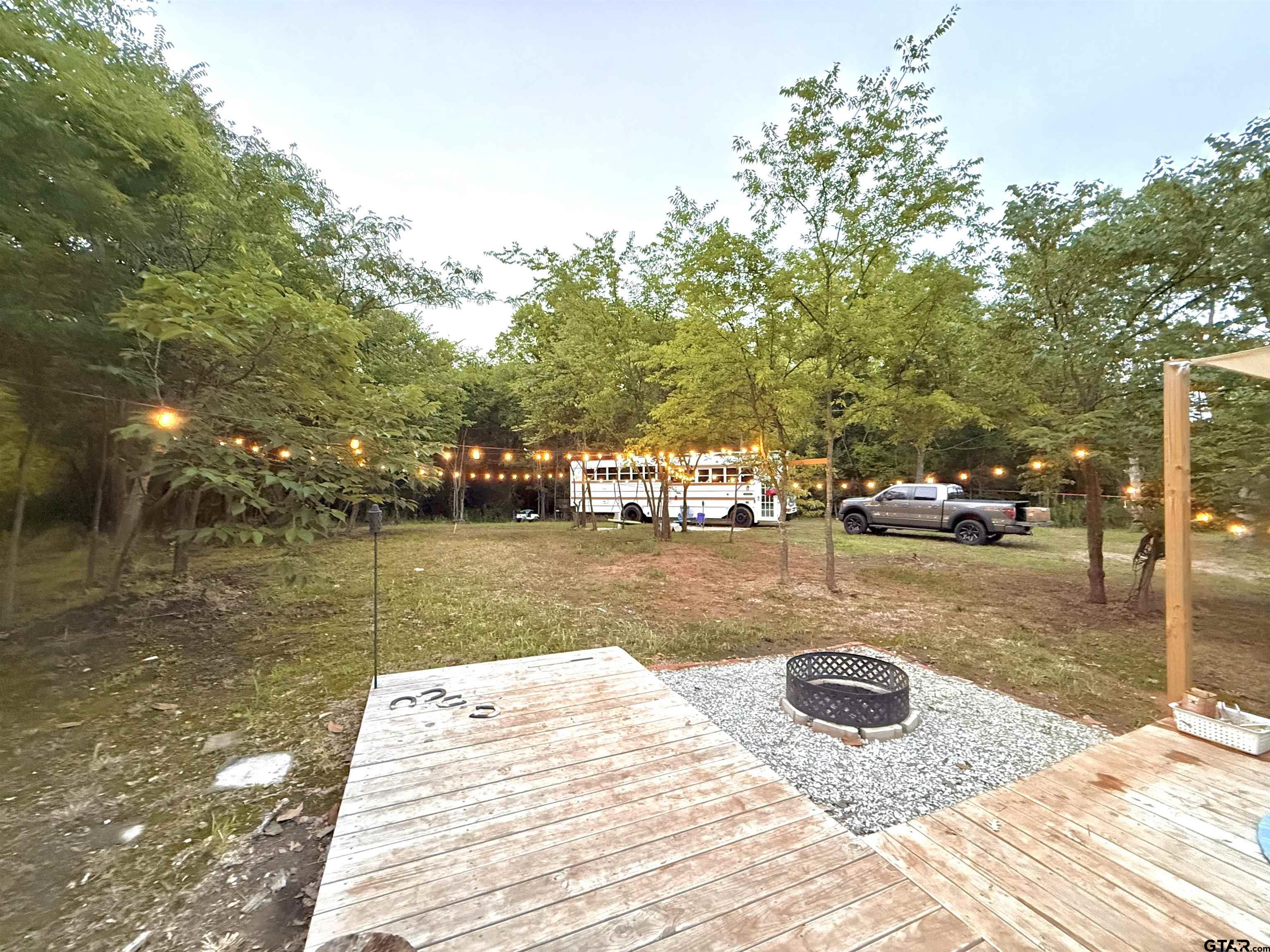 3235 County Road Cookville, TX 75558 - Photo 13 of 38 a view of a swimming pool with a patio