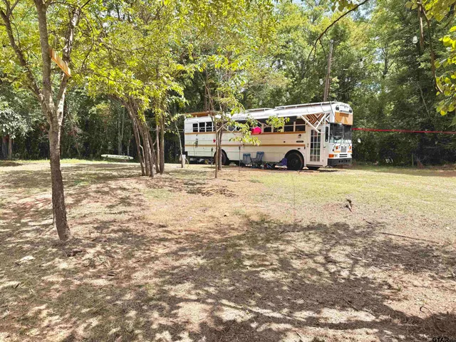 a house with trees in the background