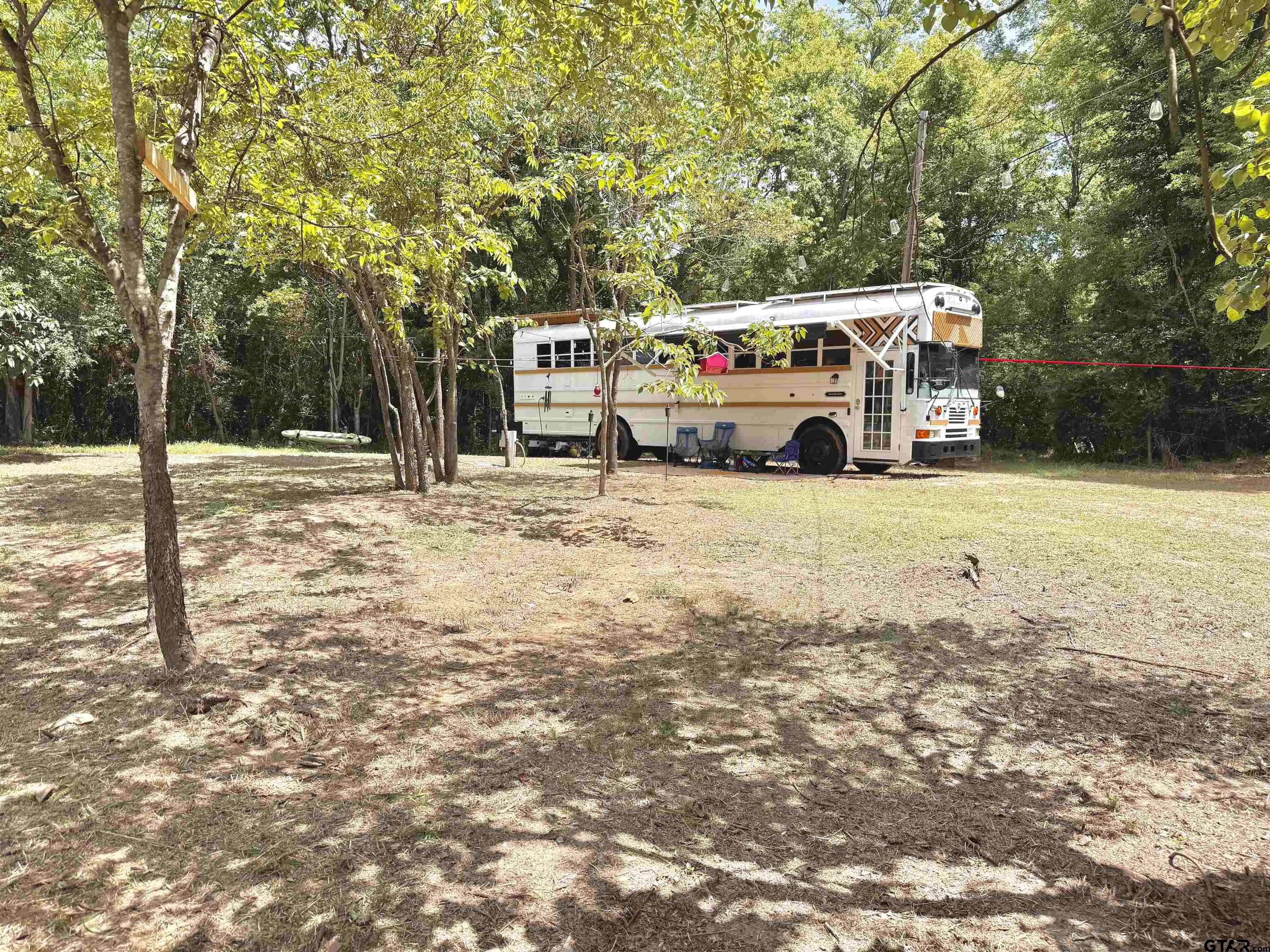 3235 County Road Cookville, TX 75558 - Photo 20 of 38 a car parked in front of a house