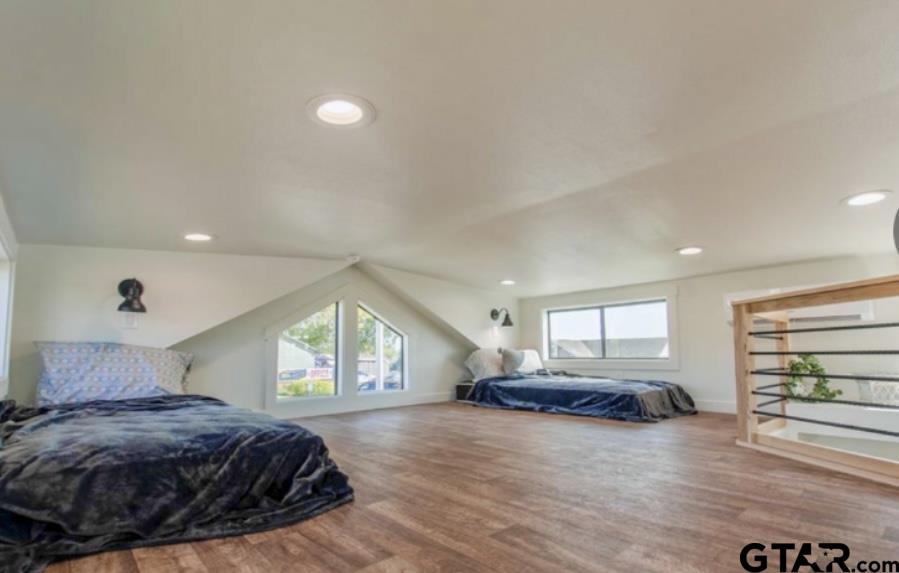3235 County Road Cookville, TX 75558 - Photo 25 of 38 a spacious bedroom with a bed and a large window