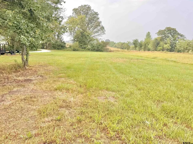 a kitchen with stainless steel appliances a refrigerator and a window