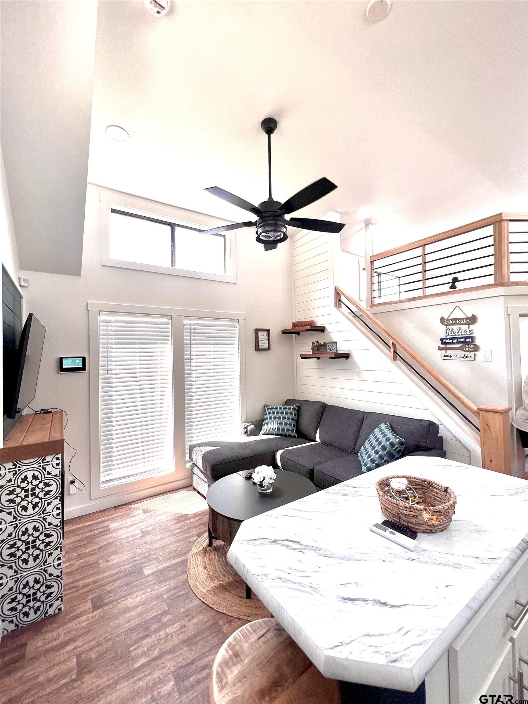 3235 County Road Cookville, TX 75558 - Photo 38 of 38 a living room with furniture and a wooden floor