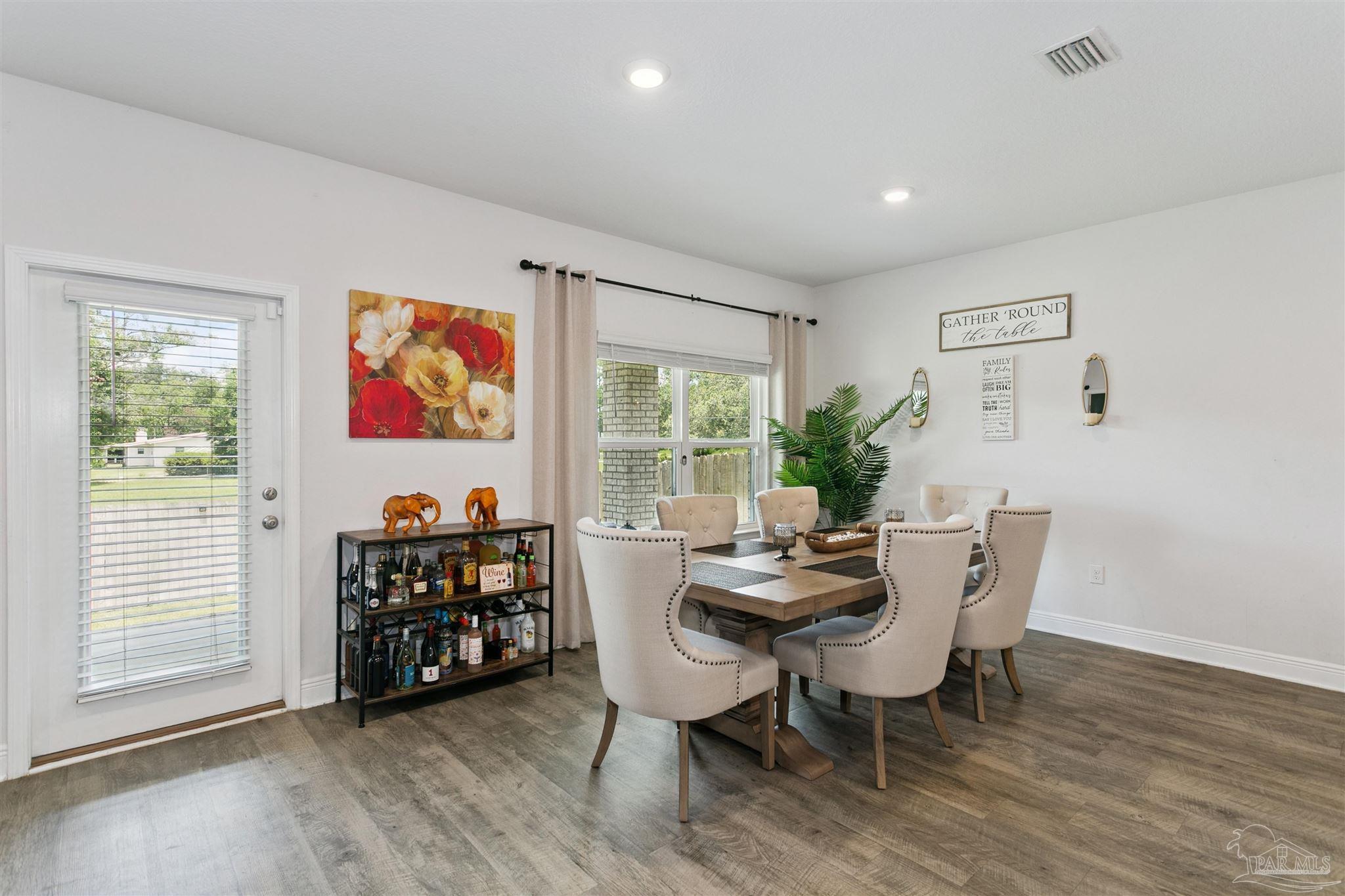 8038 Burnside Loop Pensacola, FL 32526 - Photo 21 of 48 a view of a livingroom with furniture window and wooden floor