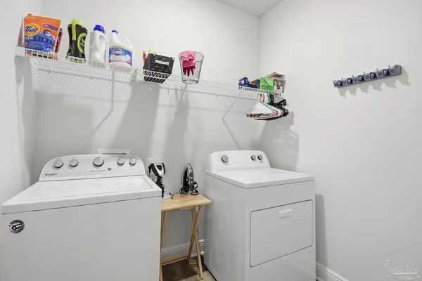 a utility room with dryer and washer