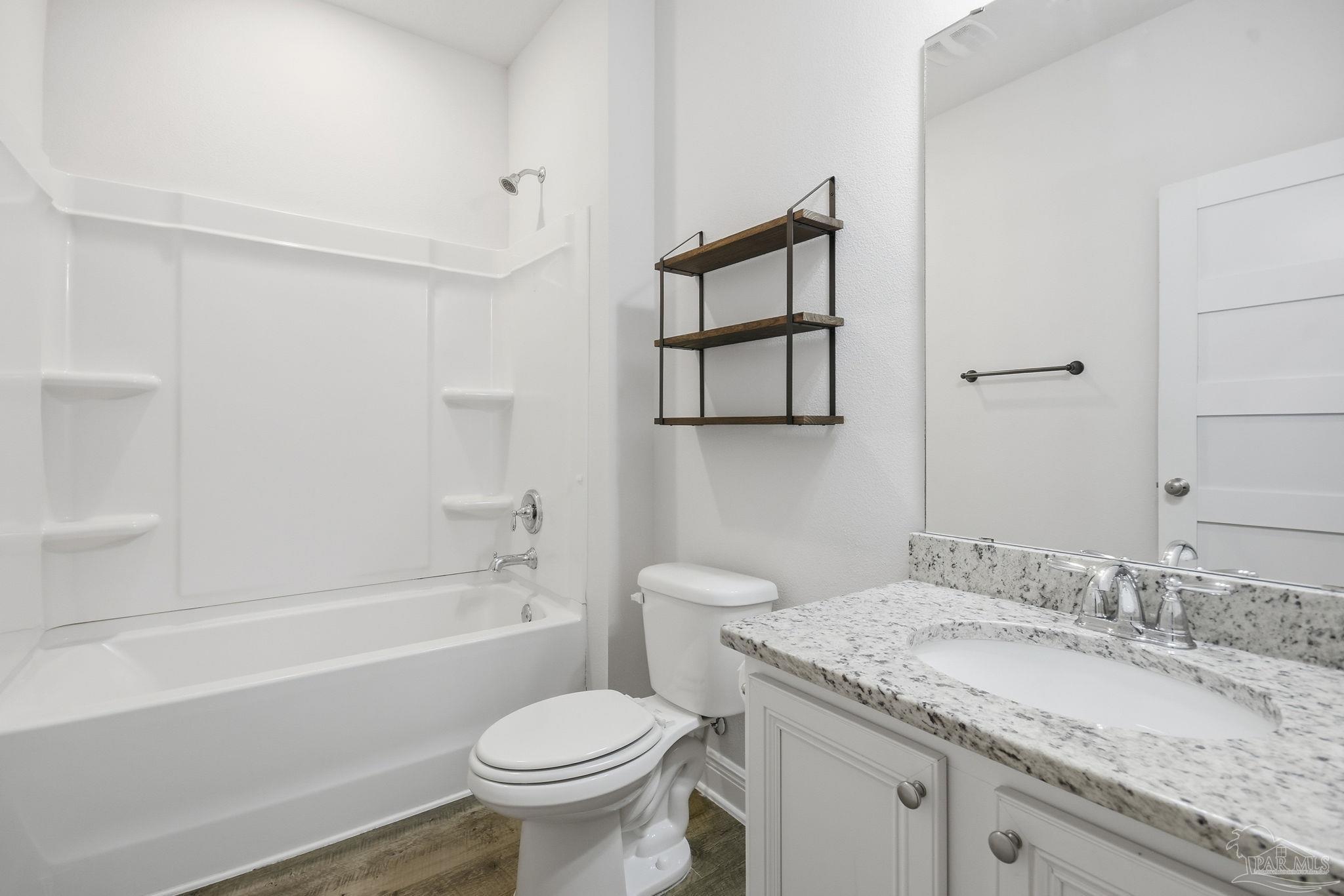 8038 Burnside Loop Pensacola, FL 32526 - Photo 25 of 48 a bathroom with a granite countertop sink toilet and shower