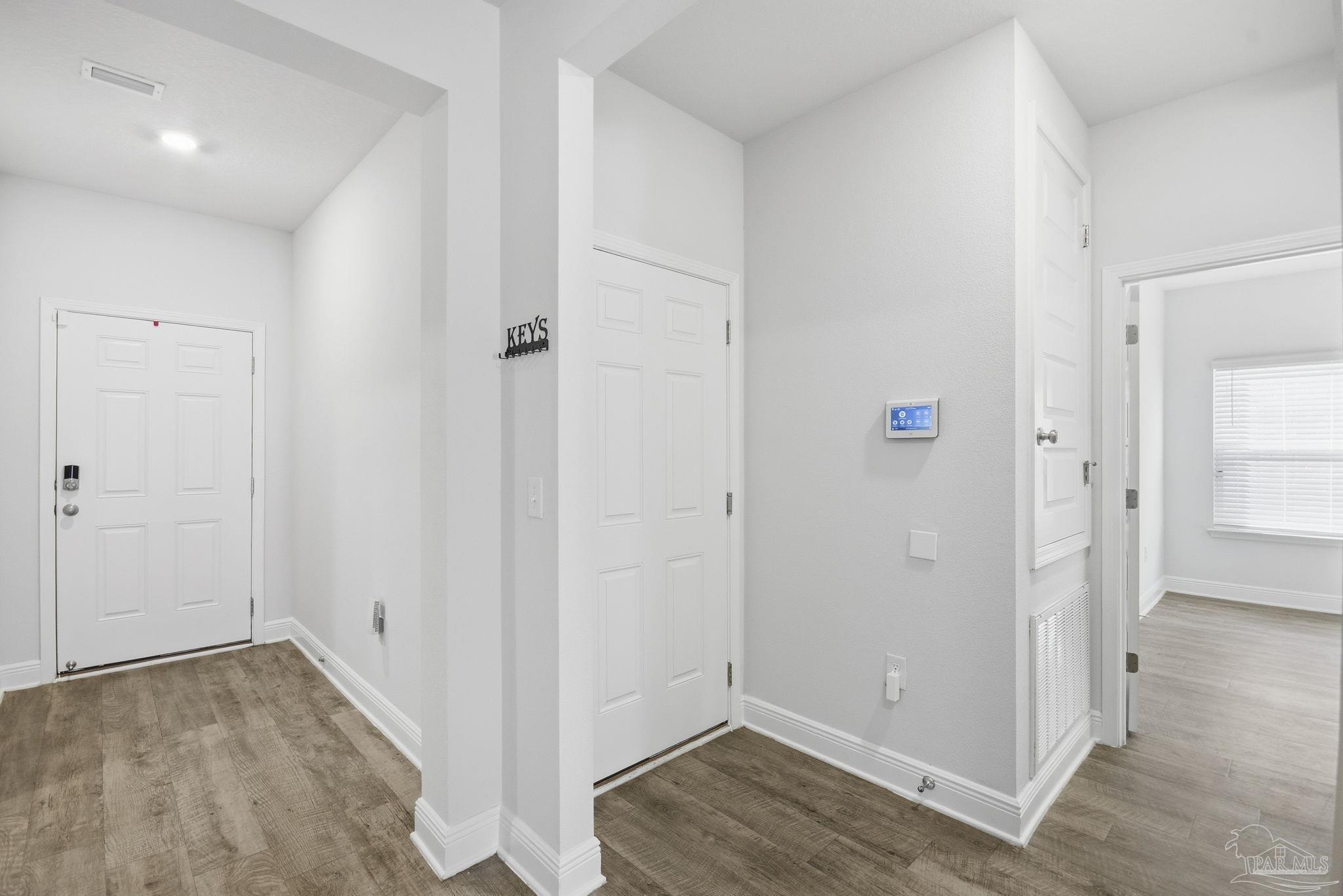 8038 Burnside Loop Pensacola, FL 32526 - Photo 28 of 48 an empty room with wooden floor