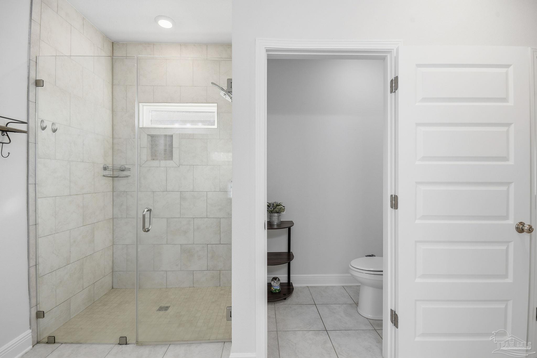 8038 Burnside Loop Pensacola, FL 32526 - Photo 37 of 48 a bathroom with a shower and toilet