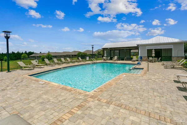 a view of a swimming pool with a patio