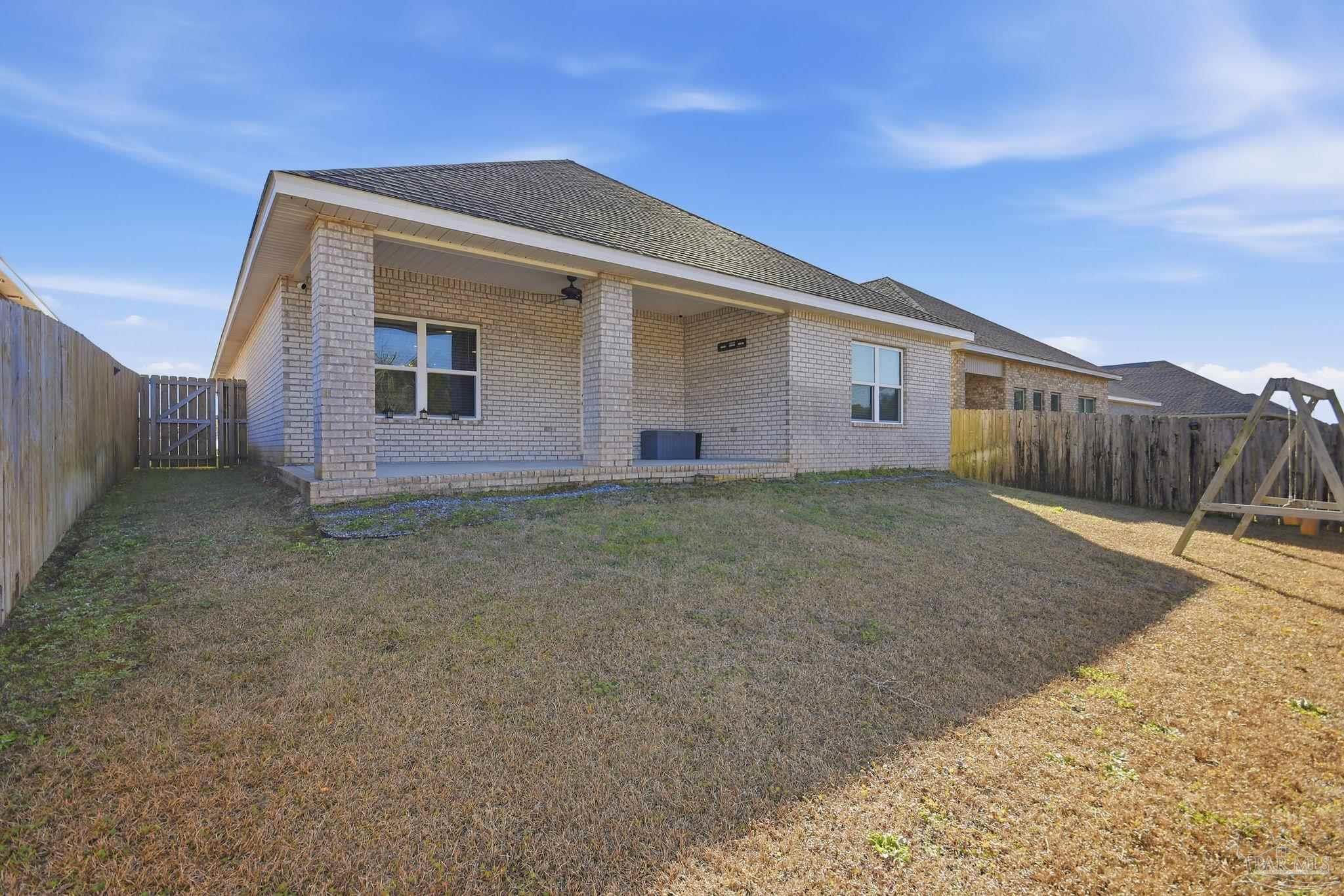 8038 Burnside Loop Pensacola, FL 32526 - Photo 42 of 48 a front view of a house with a yard