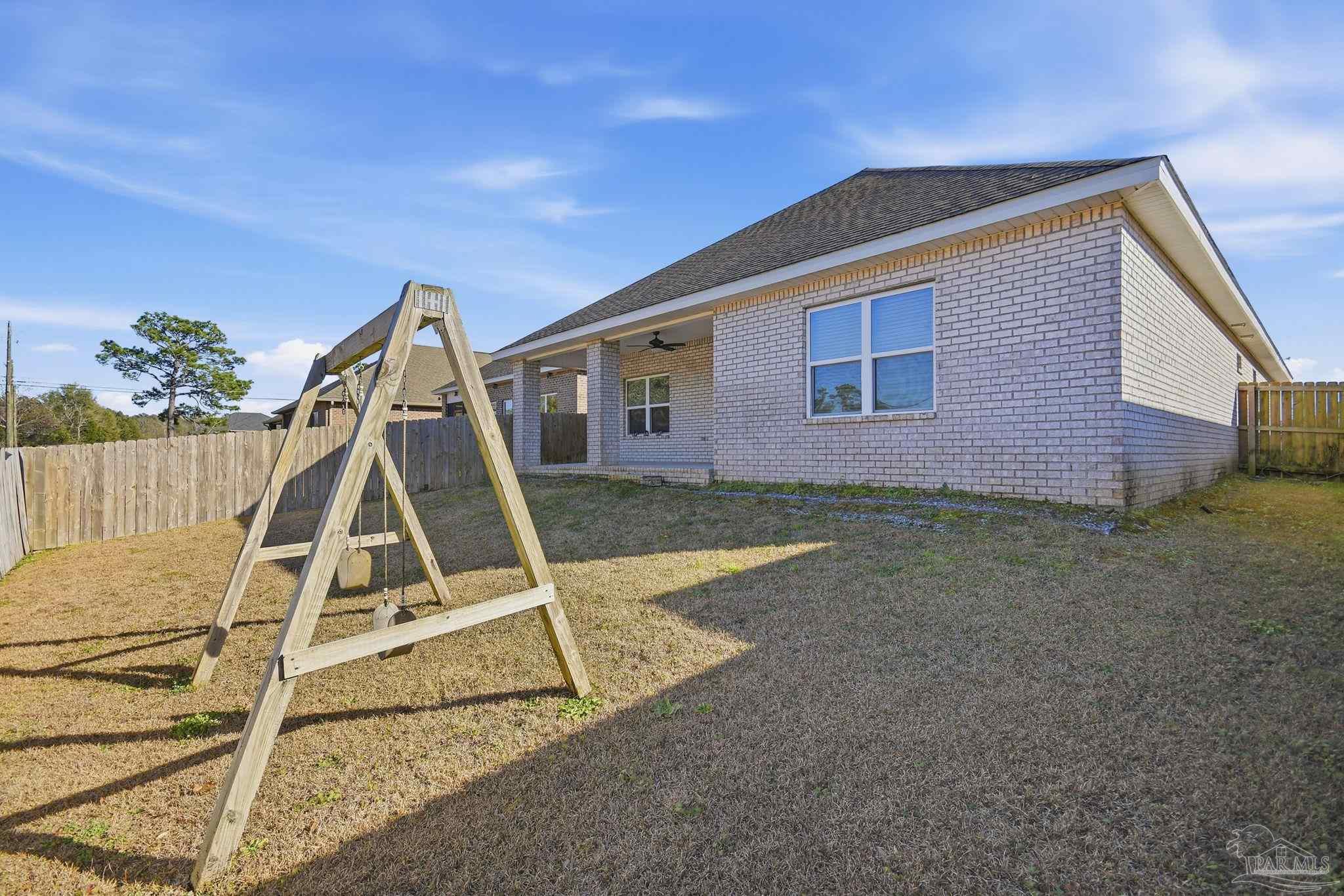 8038 Burnside Loop Pensacola, FL 32526 - Photo 43 of 48 a front view of a house with a yard