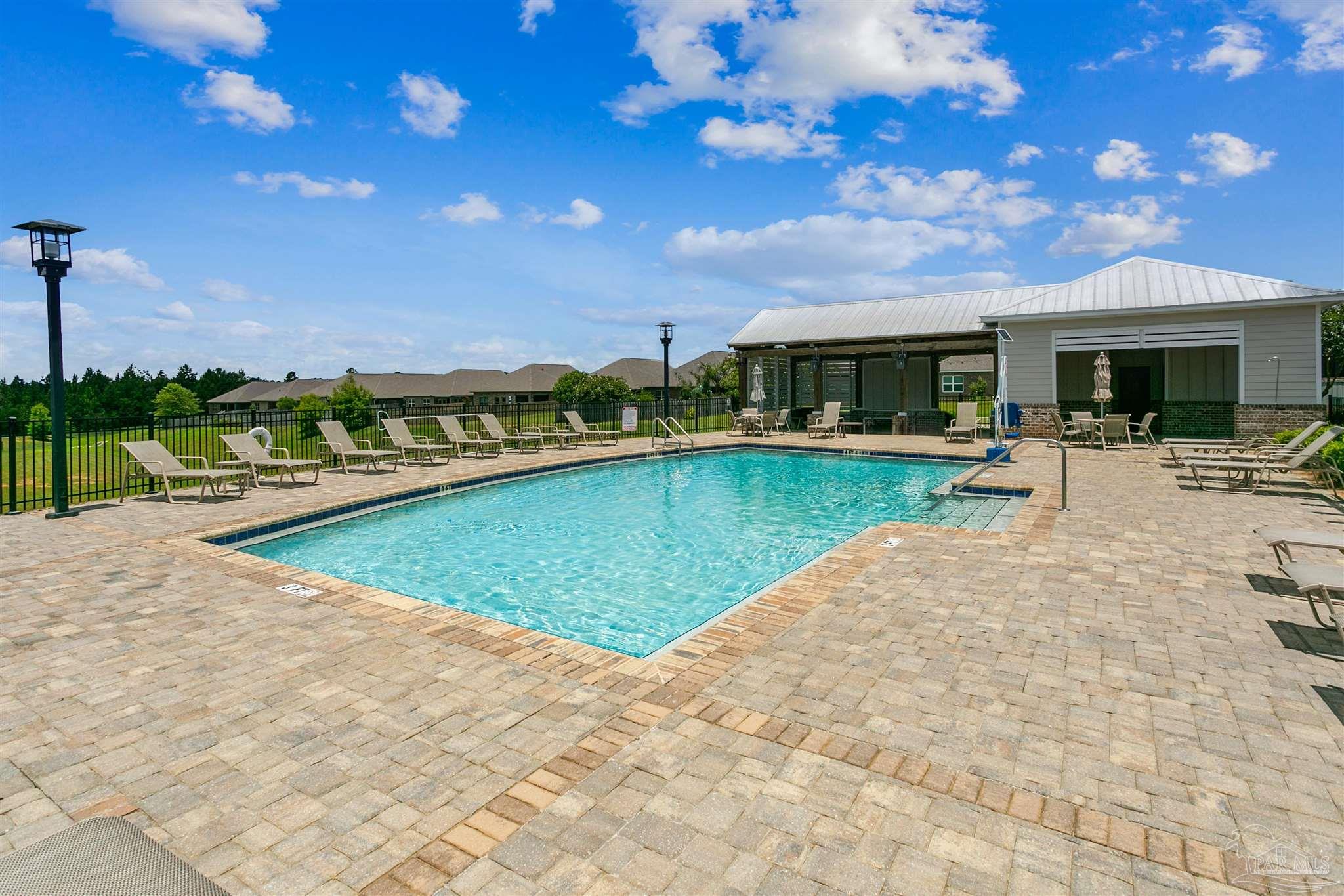 8038 Burnside Loop Pensacola, FL 32526 - Photo 46 of 48 a view of a swimming pool with a patio