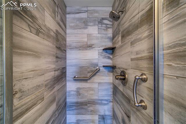 6604 Watusi Road Peyton, CO 80831 - Photo 17 of 40 Bathroom with a tile shower